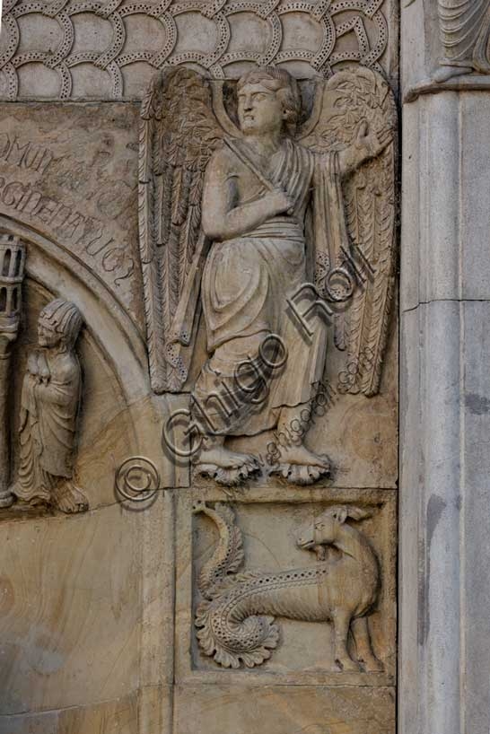 Sculpture of Capricorn and bas-relief of angel pointing the way to Rome, Fidenza Cathedral