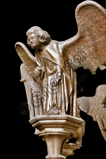 Particolare del simbolo di San Matteo, candeliere in ottone del Duomo di Genova, manifattura di Dinant XV secolo