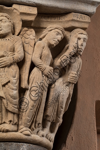 Detail sculpture Capital of the Judges, Ghirlandina Tower Modena: angel and man in supplication
