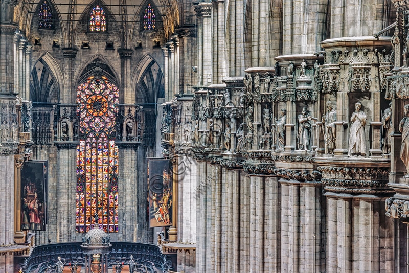 Milan Cathedral Duomo, interior view of the central nave and the series of capitals on the right pillars