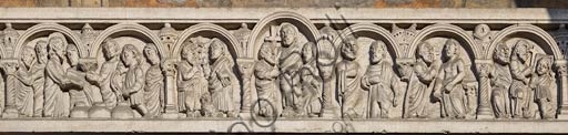 Detail of the neoromanesque sculptures by Pier Enrico Astorri on the epistyle of Piacenza Cathedral's main portal
