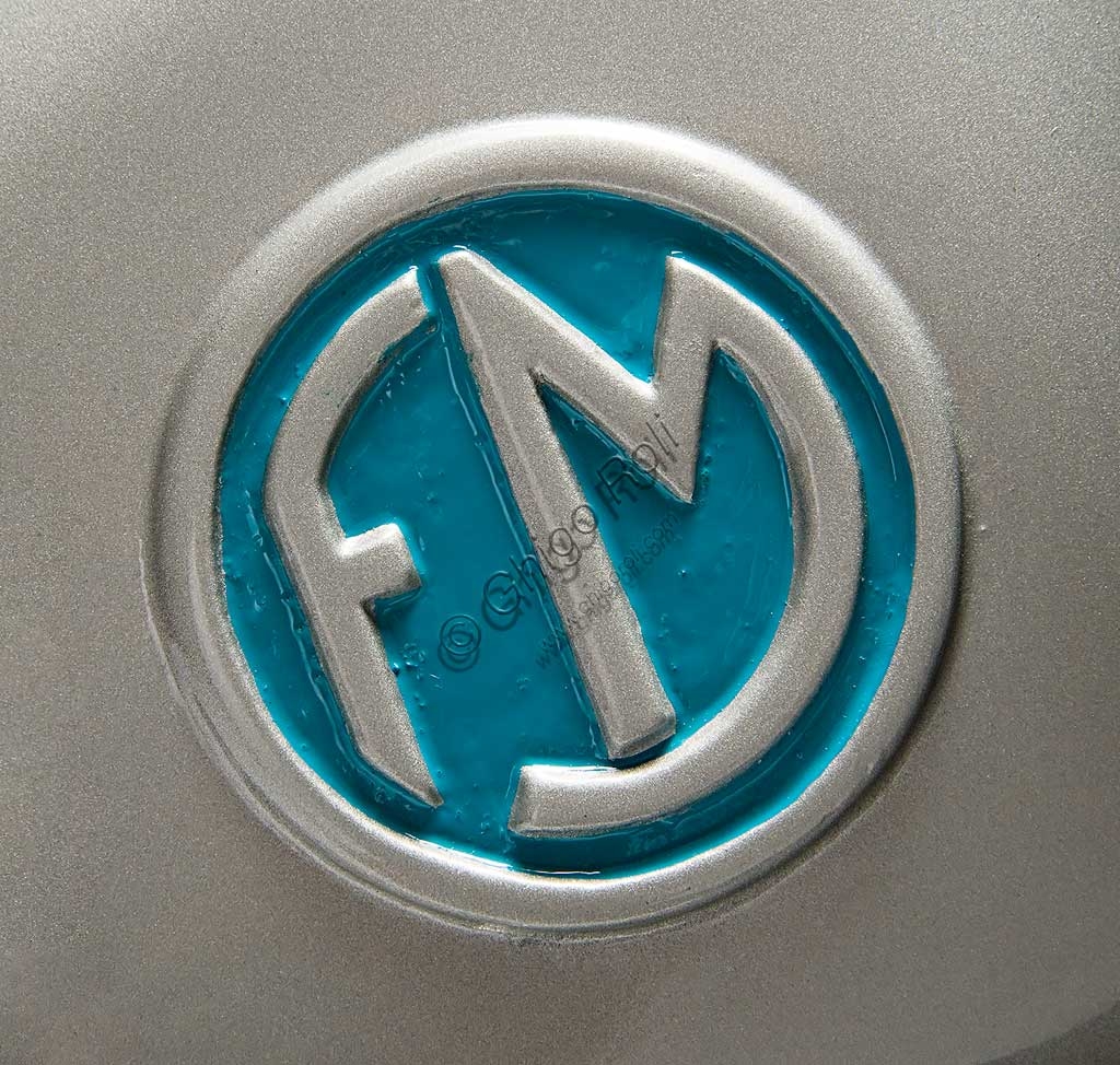 Restored 1950 F.M. Fratelli Molteni 125cc 2-stroke scooter, detail of the aluminum frame and finned exhaust