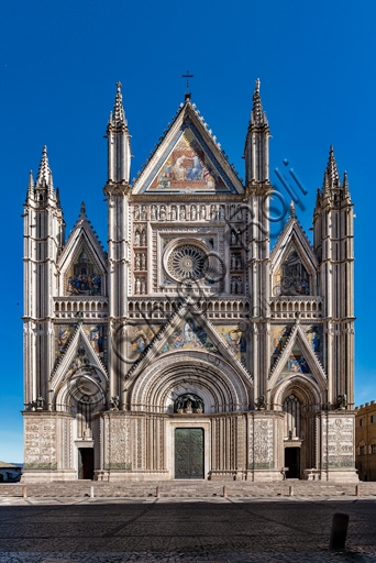 Tricuspid Gothic facade of Orvieto Cathedral, Italy, with bas-reliefs and Orcagna's rose window