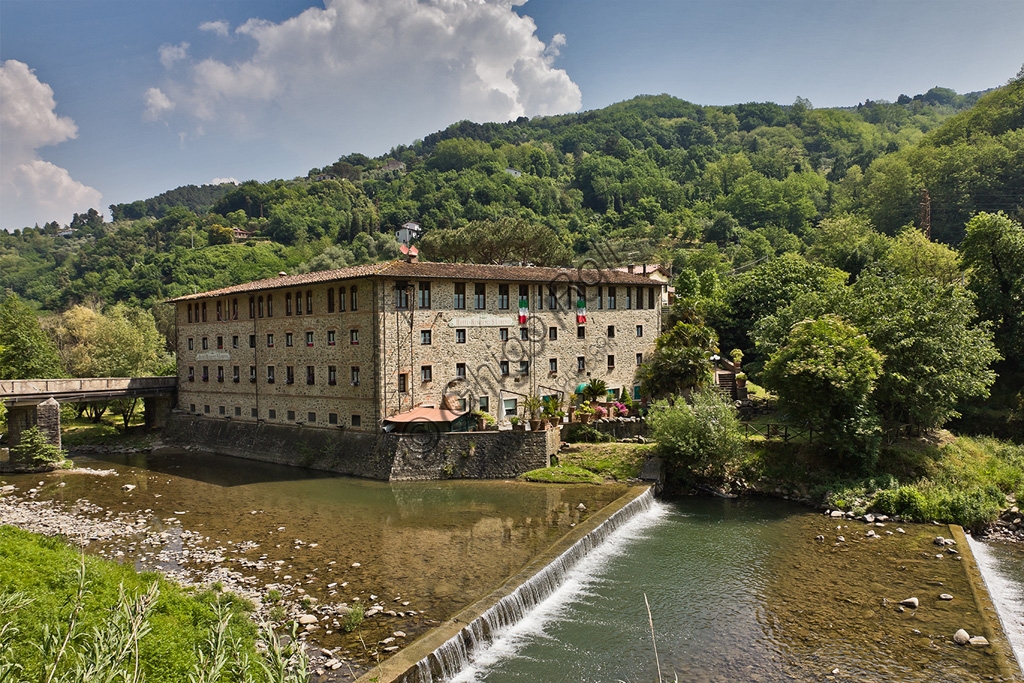 Exterior view of Palazzo San Lorenzo Hotel, a converted historic paper mill on the banks of Pescia creek