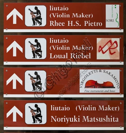 Photo of a luthier's sign in Cremona historic centre, representing Italian violin making tradition