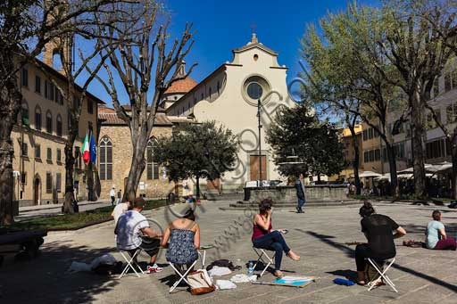 Outdoor painting class in Piazza Santo Spirito, Florence, with the facade of the Basilica of Santo Spirito in the background