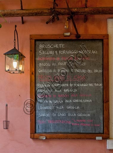Blackboard with the menu of a trattoria restaurant in Malcesine, Italy