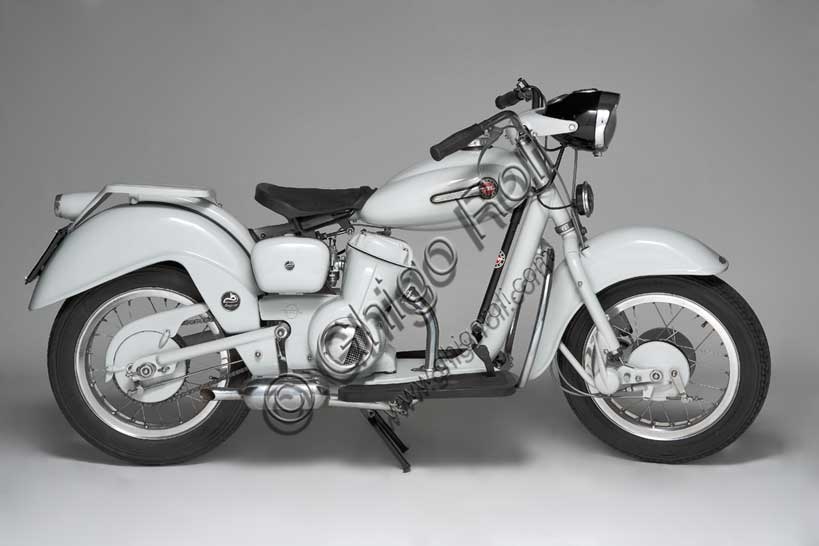 Restored 1954 Motom Delfino Italian vintage scooter, side profile highlighting the dolphin-inspired fenders