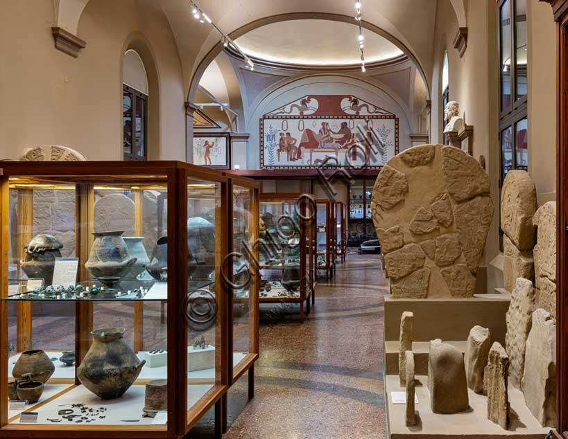 Display of Etruscan necropolis artifacts and tomb models in Room 102 of the Archaeological Museum, Bologna