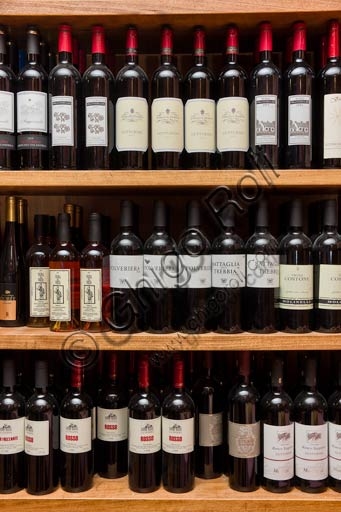 Bottles of Gutturnio and Piacenza hills wines at Osteria La Carrozza in Piacenza