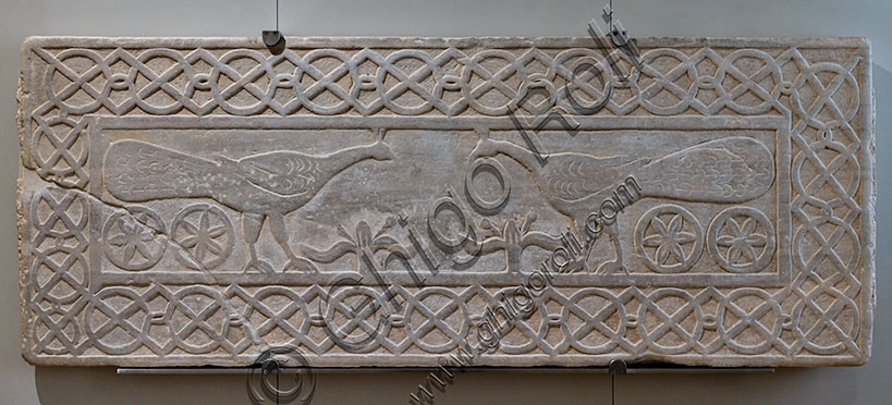 Early medieval sculptural pluteus with facing peacocks decoration carved from Greek marble