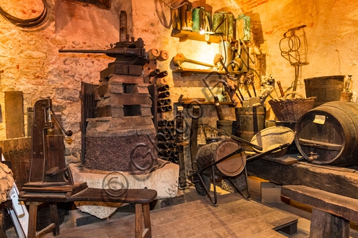 Interior of the viticulture room in the Eco Museum of Candelo Ricetto, displaying historical tools and educational panels