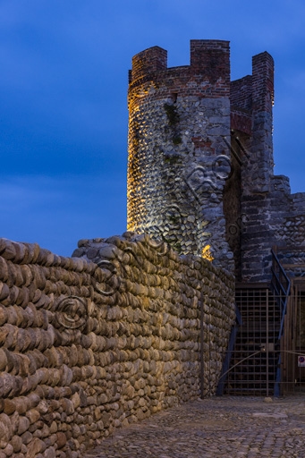 Night view of the medieval walls and the South East Tower of the Ricetto of Candelo, Piedmont, Italy