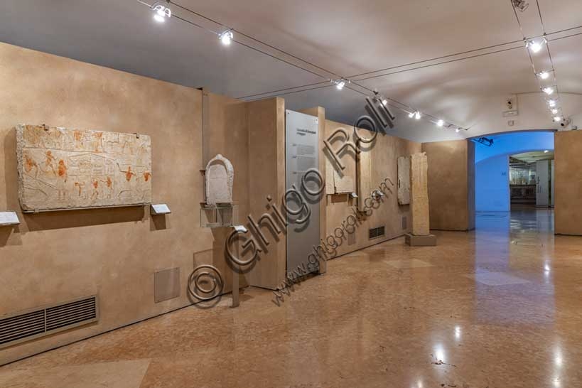 Interior of Egyptian Room 12 with artifacts at the Civic Archaeological Museum of Bologna