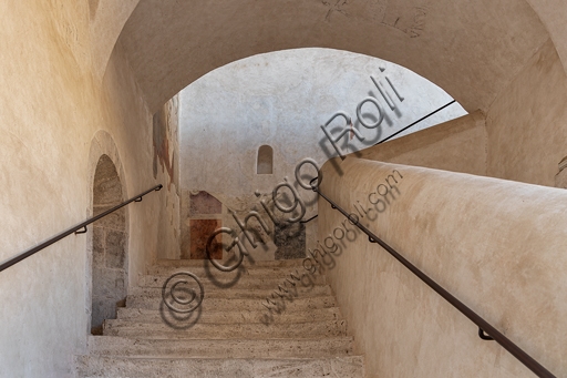 Indoor stone staircase of the Rocca Albornoz fortress in Spoleto, Umbria, Italy