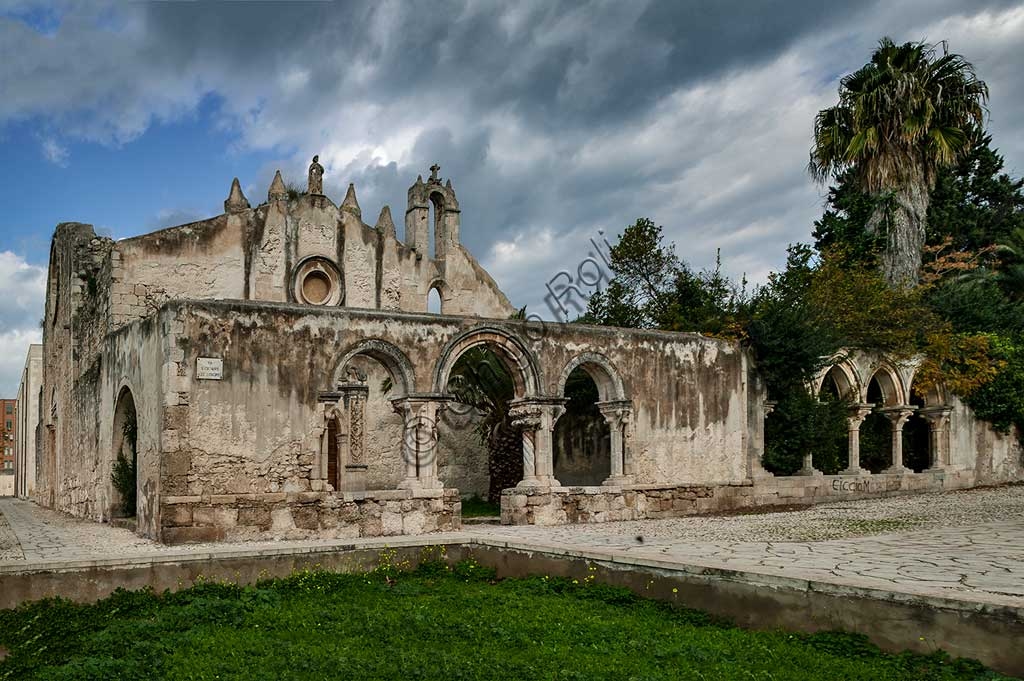 View of the Church of St John at the Catacombs in Syracuse, Sicily, featuring paleochristian architecture and archaeological site.