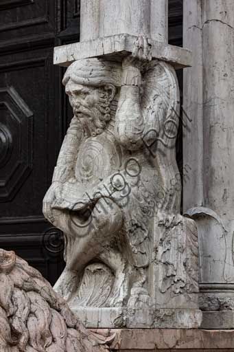 Sculptural detail of the telamon supporting the Romanesque prothyrum on the façade of the Cathedral of St. George in Ferrara