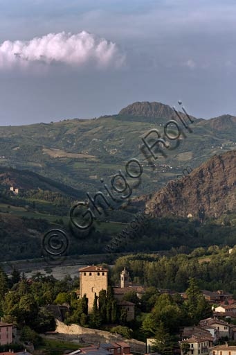 Landscape view of a medieval tower house in the village of Bobbio, set within the natural context of the Trebbia Valley in Italy