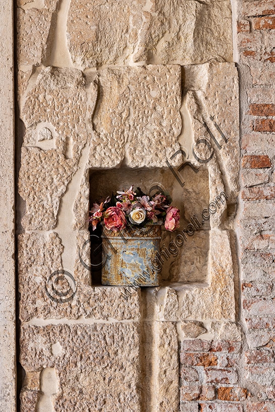 Flower vase in a niche of the porch of the Palladian Basilica in Vicenza, Italy