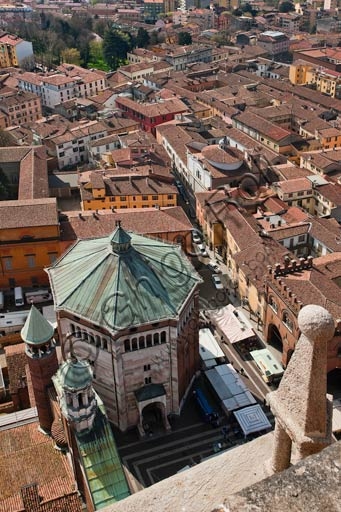Aerial panoramic view of the city of Cremona taken from the top of the Torrazzo bell tower, with the Romanesque Baptistery visible below.