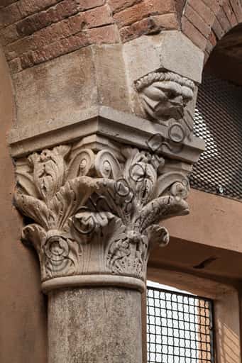 Corinthian Capital with Sculpted Face in Modena's Ghirlandina Tower