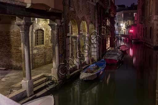 Venice at Night: A Serene View of a Rio and Its Reflections
