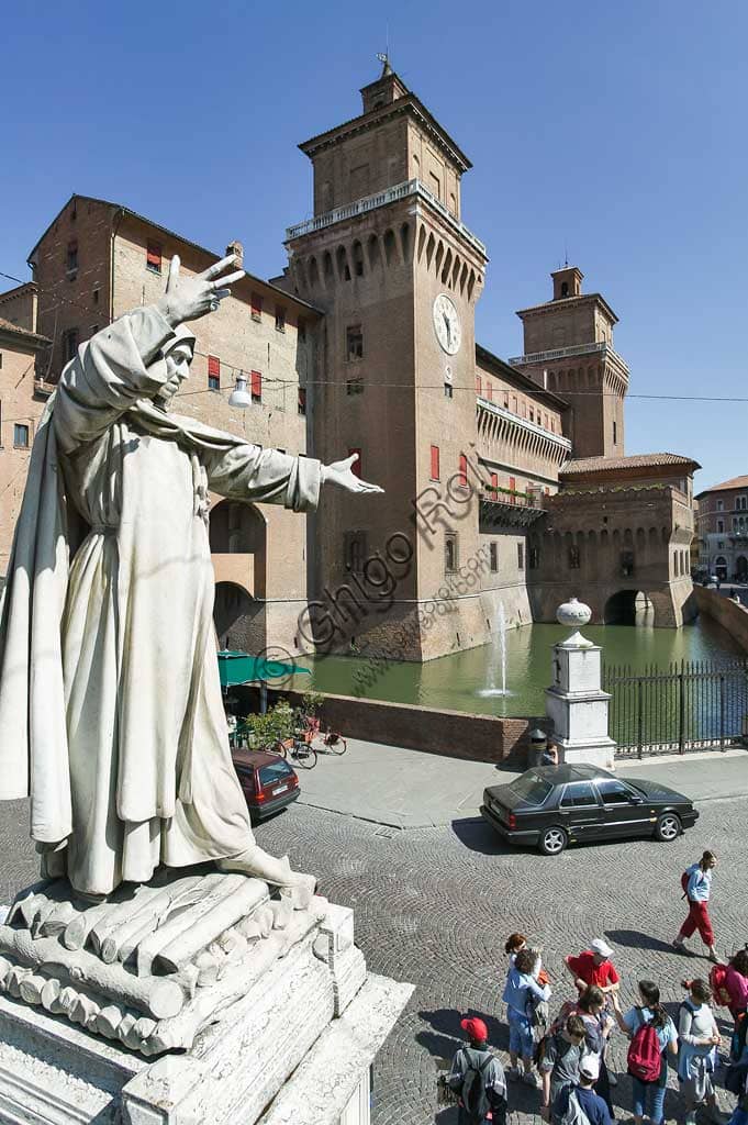Estense Castle in Ferrara with statue of Girolamo Savonarola in foreground - landmark and tourist attraction