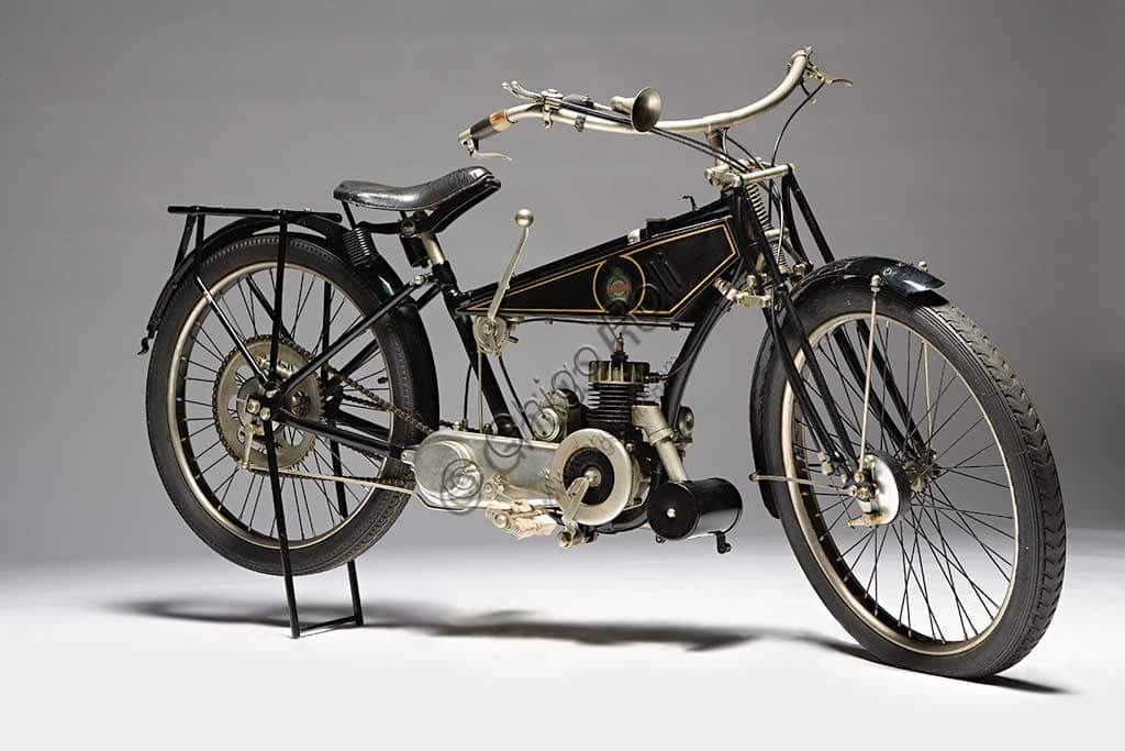 Photograph of a restored 1926 Benelli 125 vintage motorcycle, featuring a lowered frame and a two-stroke single-cylinder engine