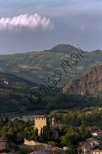 Landscape view of a medieval tower house in the village of Bobbio, set within the natural context of the Trebbia Valley in Italy