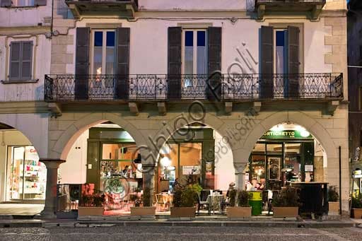 Broletto Square Pavia: Night View of the Historic Portico with Bar Tables