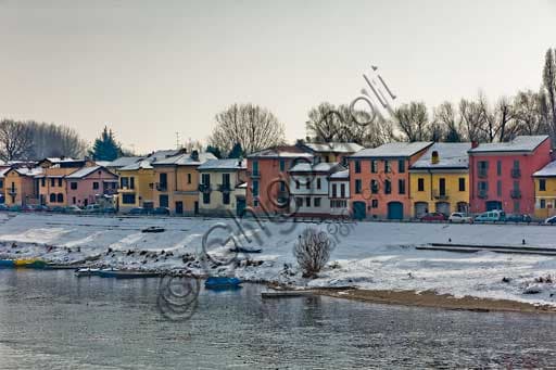 Borgo Ticino Pavia: Winter Scene of Historic Houses by the Snowy Tessin River