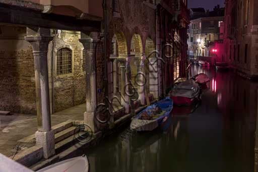 Venice at Night: A Serene View of a Rio and Its Reflections