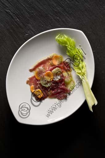 Beef Carpaccio: A Plate of Thinly Sliced Raw Meat with Garnish