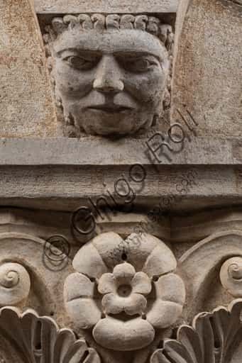Corinthian Capital with Sculpted Face in Modena's Ghirlandina Tower