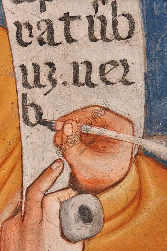La mano che scrive 'In principio erat Verbum' nell'affresco di San Giovanni Evangelista