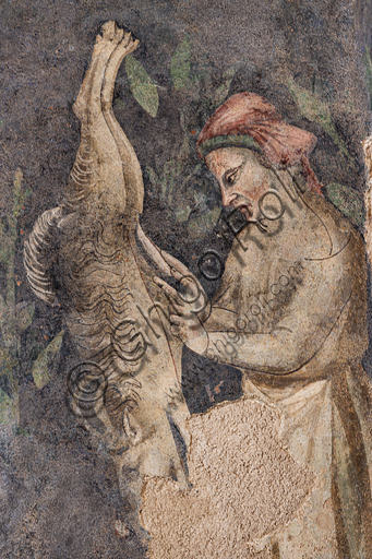Affresco Rocca Albornoz Spoleto: particolare uomo scuoia cinghiale, ciclo Teseida XIV secolo