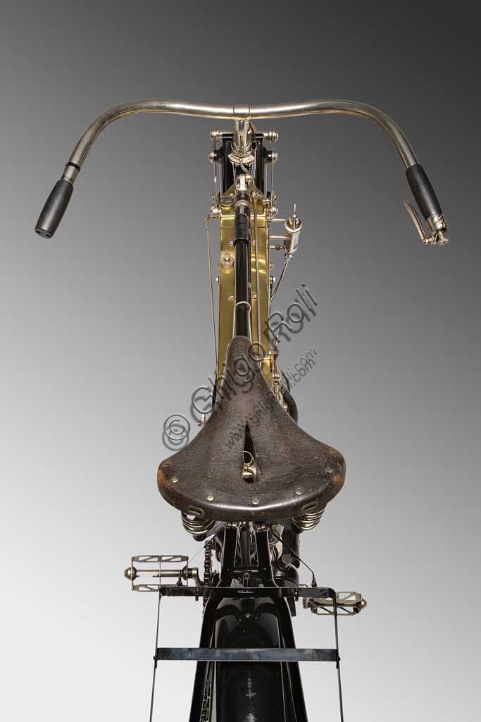 Antique 1905 FN Four Cylinder motorcycle, restored, with gleaming brass fuel tank.