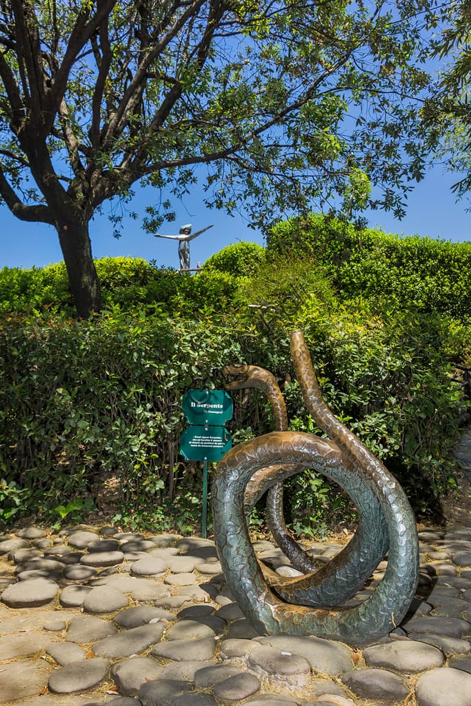 Contemporary bronze and steel statue The Serpent by artist Pietro Consagra in Pinocchio Park Italy