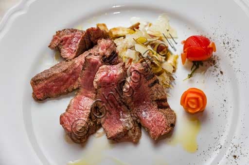 Beef tagliata with artichokes, typical Tuscan dish from La Botte di Bacco restaurant in Radda in Chianti