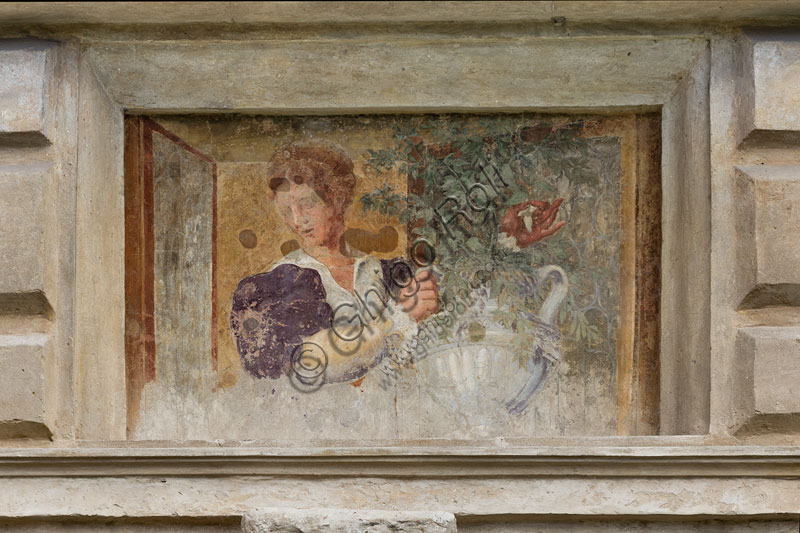 Mantua, Palazzo Te (Gonzaga's Summer residence), Cortile d'Onore (the Courtyard of Honour): detail of a tromp l'oeil fresco on the Northern side which represents a fake window and a girl holding a vase of flowers.