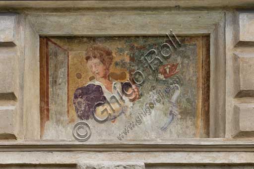 Mantua, Palazzo Te (Gonzaga's Summer residence), Cortile d'Onore (the Courtyard of Honour): detail of a tromp l'oeil fresco on the Northern side which represents a fake window and a girl holding a vase of flowers.