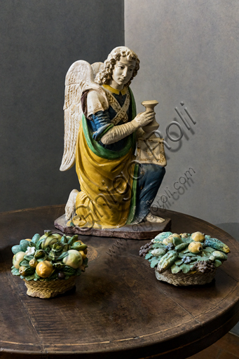  "Angel candle holder", by Benedetto Buglioni, 1480 - 90, and "Baskets with flowers and fruit", by Giovanni della Robbia's workshop, first quarter of the XVI century,  polychrome glazed terracotta.