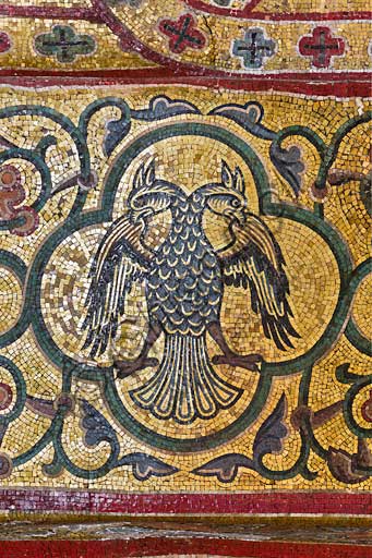 Palermo, The Royal Palace or Palazzo dei Normanni (Palace of the Normans), Pisana Tower,  the King Roger Room (the Room which was commissioned by King Roger II d'Altavilla): decoration of the arch below the vault with mosaics of animals. These mosaics date back to the period of Frederick II.Detail with double headed eagle (emblem of Emperor Frederik II).