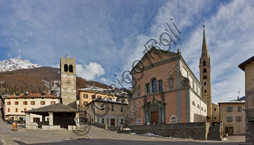  Bormio, Historical Centre, Cavour or Kuerc Square. Here there are the Kuerc (low loggia with a slate roof where justice was administered and people's assemblies were held), the people's Tower with the "Baiona" (big bell which was rung to to call the council of the region to meeting) and the Collegiate Church dei SS. Gervasio and Protasio.