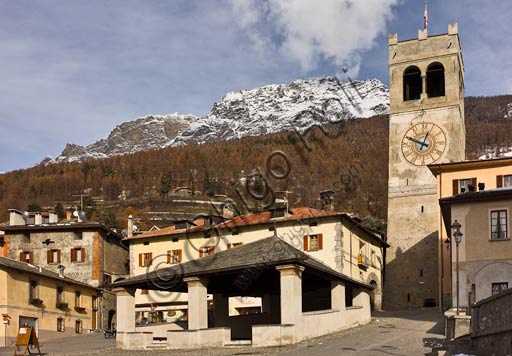  Bormio, Historical Centre, Cavour or Kuerc Square. Here there are the Kuerc (low loggia with a slate roof where justice was administered and people's assemblies were held), the people's Tower with the "Baiona" (big bell which was rung to to call the council of the region to meeting).