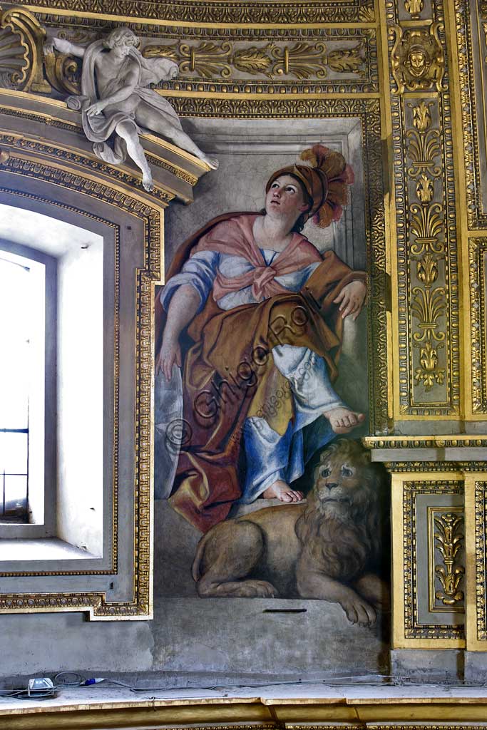 Basilica of St Andrew della Valle, the bowl-shaped vault of the apse: the Fortitude with a lion (one of the six female allegorical figure representing Virtues).  Frescoes realised between the big windows by Domenichino (Domenico Zampieri), 1622 - 1628.
