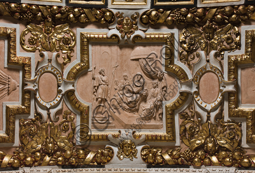 Genoa, Duomo (St. Lawrence Cathedral), the Chapel of St. John the Baptist, Western wall, archivolt with episodes of the life of St. John: "The Baptist in front of Herod",  central tile, modeled and engraved terracotta. 