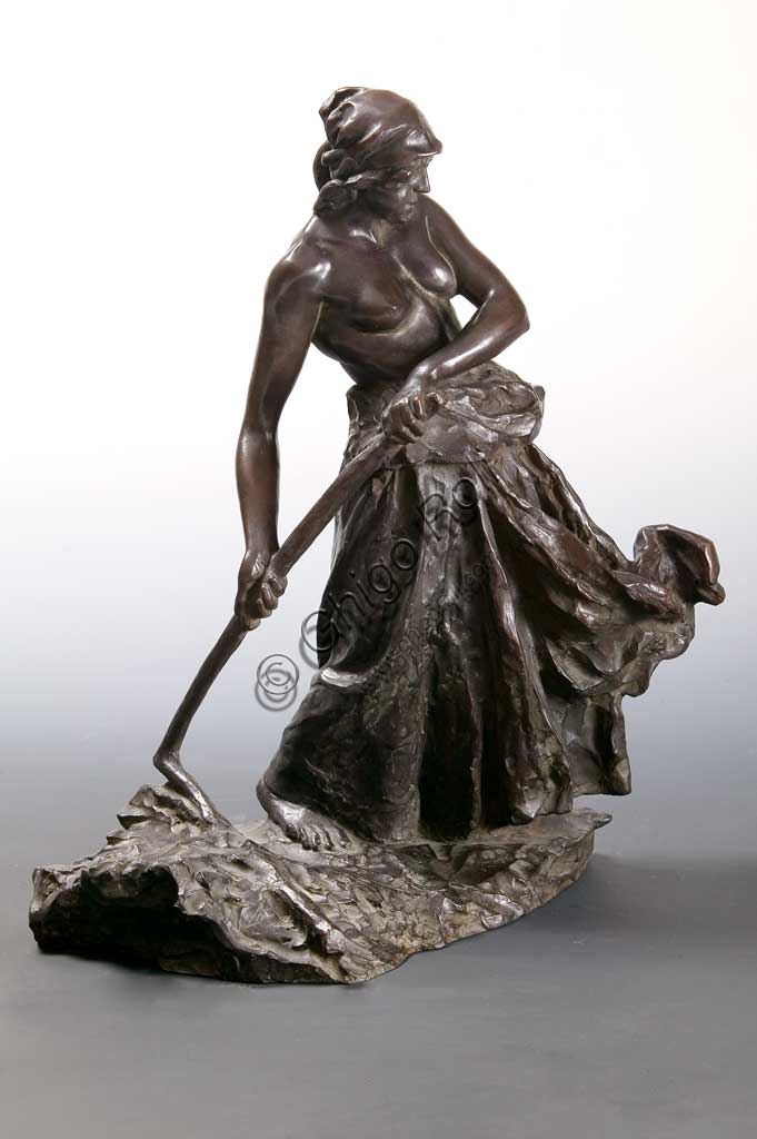 Assicoop - Unipol Collection: "Woman beating the Wheat", bronze statue, by Giuseppe Graziosi (1879 - 1942).