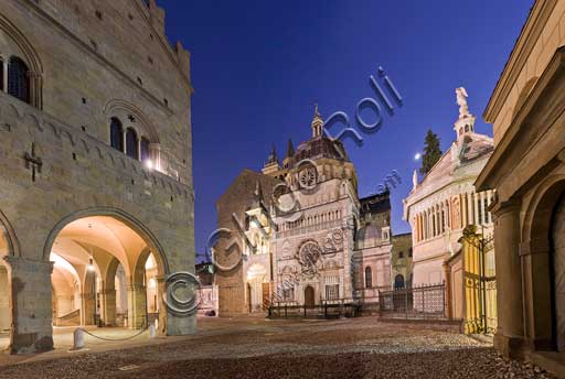 Bergamo, Città alta: night view of  the porch of  Palazzo della Ragione (Ragione Palace). In the background,  the Colleoni Chapel.