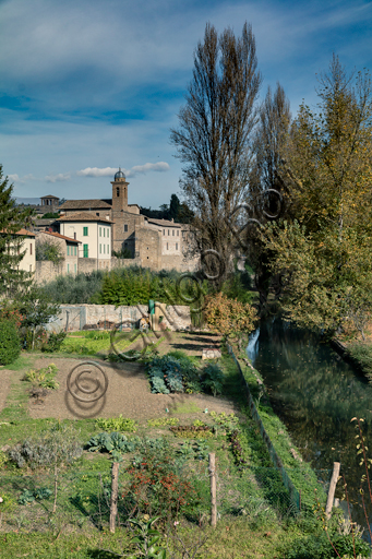 Bevagna: partial view of the town with its walss and the kitchen garden by the river Topino.